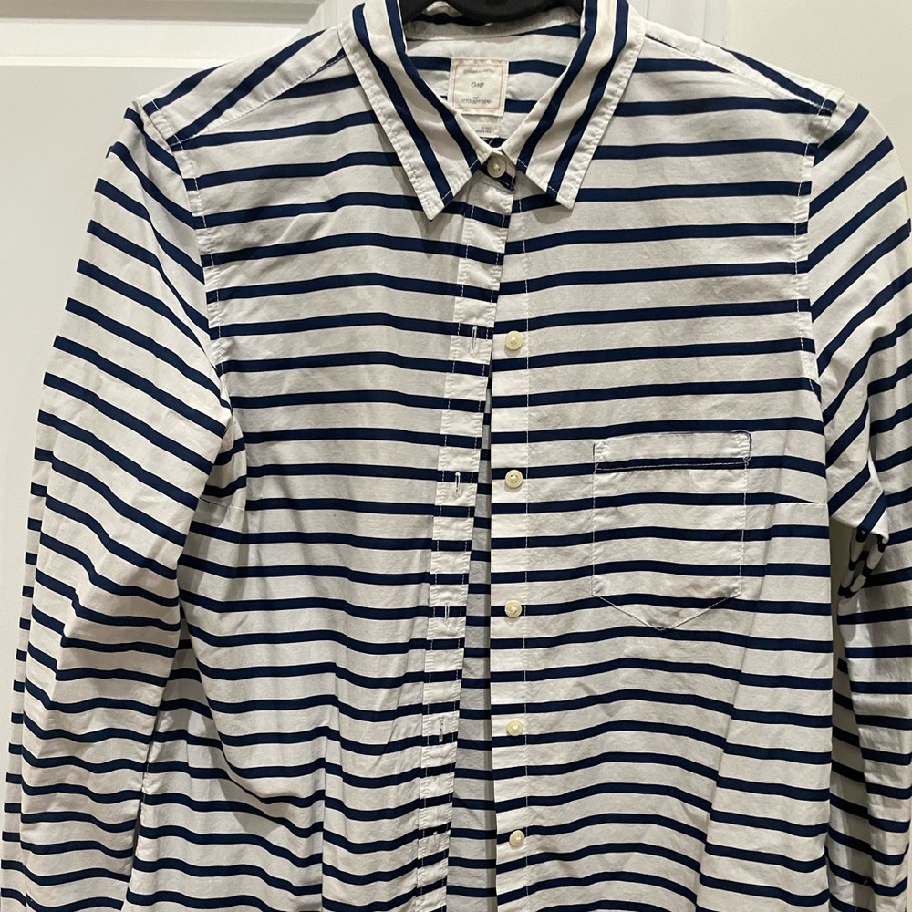 White button up shirt with blue stripes.